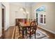 Formal dining room with wood floors, traditional furnishings, and natural light at 10352 Burris Ct, Orlando, FL 32836