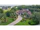 Aerial view of the house, highlighting mature landscaping and a grand entrance at 10352 Burris Ct, Orlando, FL 32836