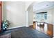 Open foyer with slate tile transitioning into hardwood, an archway, column, and views of the backyard at 10352 Burris Ct, Orlando, FL 32836