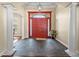 Foyer featuring slate tile flooring, decorative columns, and a grand entrance with double doors at 10352 Burris Ct, Orlando, FL 32836