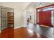 Foyer features tile and wood floors, an arched entryway and wine storage at 10352 Burris Ct, Orlando, FL 32836