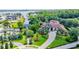 Gorgeous house with a circular driveway, lush landscaping, and large front lawn at 10352 Burris Ct, Orlando, FL 32836