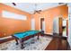Game room features pool table, ceiling fan, and neutral color scheme at 10352 Burris Ct, Orlando, FL 32836