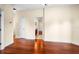Hallway with hardwood floors leading to bath and closet at 10352 Burris Ct, Orlando, FL 32836