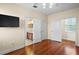 Hallway with hardwood floors leading to bath at 10352 Burris Ct, Orlando, FL 32836