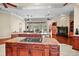 Open-concept kitchen with dual islands, cooktop, and access to the living room at 10352 Burris Ct, Orlando, FL 32836