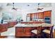 Gourmet kitchen with granite countertops, custom cabinetry, and stainless-steel appliances at 10352 Burris Ct, Orlando, FL 32836