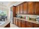 Kitchen featuring granite countertops, stainless steel appliances and wood cabinets at 10352 Burris Ct, Orlando, FL 32836
