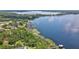 Beautiful lake view with docks, clear blue water, and lush green trees at 10352 Burris Ct, Orlando, FL 32836