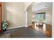 Open-concept living room with hardwood floors, leading to an outdoor patio with pool view at 10352 Burris Ct, Orlando, FL 32836