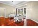 Bright living room featuring hardwood floors and French doors leading to the outdoor patio at 10352 Burris Ct, Orlando, FL 32836