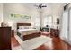 Spacious main bedroom features a ceiling fan, a high ceiling and an ensuite bathroom at 10352 Burris Ct, Orlando, FL 32836