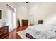 Spacious main bedroom features a ceiling fan, a high ceiling and an ensuite bathroom at 10352 Burris Ct, Orlando, FL 32836