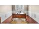 Home office featuring a large wooden desk, hardwood floors and wainscoting at 10352 Burris Ct, Orlando, FL 32836