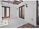 Covered outdoor patio with dual doors and concrete flooring at 10352 Burris Ct, Orlando, FL 32836