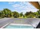 Screened in pool area with view of lush landscaping at 10352 Burris Ct, Orlando, FL 32836