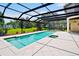 Enclosed pool with views of the yard and lake beyond at 10352 Burris Ct, Orlando, FL 32836