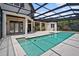The screened-in pool features a deck, clear water and views of the home at 10352 Burris Ct, Orlando, FL 32836
