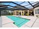 Screened-in pool area with a large pool, spa, and ample patio space for entertaining at 10352 Burris Ct, Orlando, FL 32836