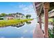 Waterfront property view from the dock, showcasing the main house and scenic lake views at 10352 Burris Ct, Orlando, FL 32836