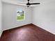 Spacious bedroom with ceiling fan and window view at 14837 Sussex Dr, Orlando, FL 32826
