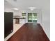 Open kitchen and dining area with stainless steel appliances and sliding glass door at 14837 Sussex Dr, Orlando, FL 32826