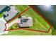 An aerial view of a home with solar panels with a well maintained backyard and lake view at 15208 Lake Claire Overlook Dr, Winter Garden, FL 34787