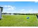 Spacious backyard with lake view and plenty of room for activities at 15208 Lake Claire Overlook Dr, Winter Garden, FL 34787