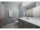 Bright bathroom with a modern vanity, a large mirror, and a shower with a patterned curtain at 15208 Lake Claire Overlook Dr, Winter Garden, FL 34787