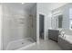 Bathroom features a glass-enclosed shower, separate tub, and modern fixtures at 15208 Lake Claire Overlook Dr, Winter Garden, FL 34787