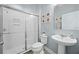 Bright bathroom with a glass enclosed shower, modern fixtures, and clean, stylish finishes at 15208 Lake Claire Overlook Dr, Winter Garden, FL 34787