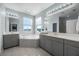 The bathroom features double vanities, a tub, and a separate shower for a spa-like experience at 15208 Lake Claire Overlook Dr, Winter Garden, FL 34787