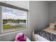 Window view of bedroom with water at 15208 Lake Claire Overlook Dr, Winter Garden, FL 34787