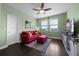 Bright bonus room featuring a ceiling fan, a comfortable sofa, and lots of natural light at 15208 Lake Claire Overlook Dr, Winter Garden, FL 34787