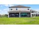 Rear exterior view of home featuring screened patio and open trellis at 15208 Lake Claire Overlook Dr, Winter Garden, FL 34787