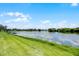 Scenic view of the calm pond, enhancing the property's appeal at 15208 Lake Claire Overlook Dr, Winter Garden, FL 34787