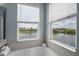 Enjoy this home's bathtub window view at 15208 Lake Claire Overlook Dr, Winter Garden, FL 34787
