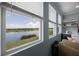 Enjoy the beautiful water view from the living room windows at 15208 Lake Claire Overlook Dr, Winter Garden, FL 34787
