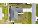 An aerial view shows the roof and yard of the property at 15476 Sw 34Th Court Rd, Ocala, FL 34473