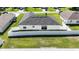 Aerial view of backyard featuring white fencing and green grass at 15476 Sw 34Th Court Rd, Ocala, FL 34473