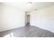 Comfortable bedroom featuring laminate wood flooring, light walls, and natural light from a window at 15476 Sw 34Th Court Rd, Ocala, FL 34473