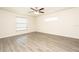 Bright bedroom with natural light from two windows and neutral walls and laminate wood flooring at 15476 Sw 34Th Court Rd, Ocala, FL 34473