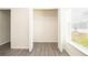 Walk-in closet features white shelving, laminate flooring, and ample storage space at 15476 Sw 34Th Court Rd, Ocala, FL 34473