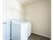 Bright laundry room featuring a white washer and dryer, shelf and wood-look floors at 15476 Sw 34Th Court Rd, Ocala, FL 34473