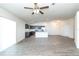 Open-concept living area and kitchen with modern stainless appliances and dark cabinets at 15476 Sw 34Th Court Rd, Ocala, FL 34473