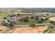 Bird's eye view of an opulent community showcasing a clubhouse, golf course, and elegant residences at 15947 Vetta Dr, Bella Collina, FL 34756