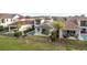 Aerial view of a beautiful backyard featuring a private pool, patio area, and lush landscaping at 15947 Vetta Dr, Bella Collina, FL 34756