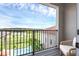 Relax on this private balcony overlooking the pool, golf course, and scenic lake views, ideal for tranquil outdoor enjoyment at 15947 Vetta Dr, Bella Collina, FL 34756