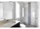 Modern bathroom with glass-enclosed shower, decorative tile, and modern vanity at 15947 Vetta Dr, Bella Collina, FL 34756