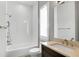 Bright bathroom features a tub, shower, modern sink, and vanity, offering a clean and contemporary space at 15947 Vetta Dr, Bella Collina, FL 34756